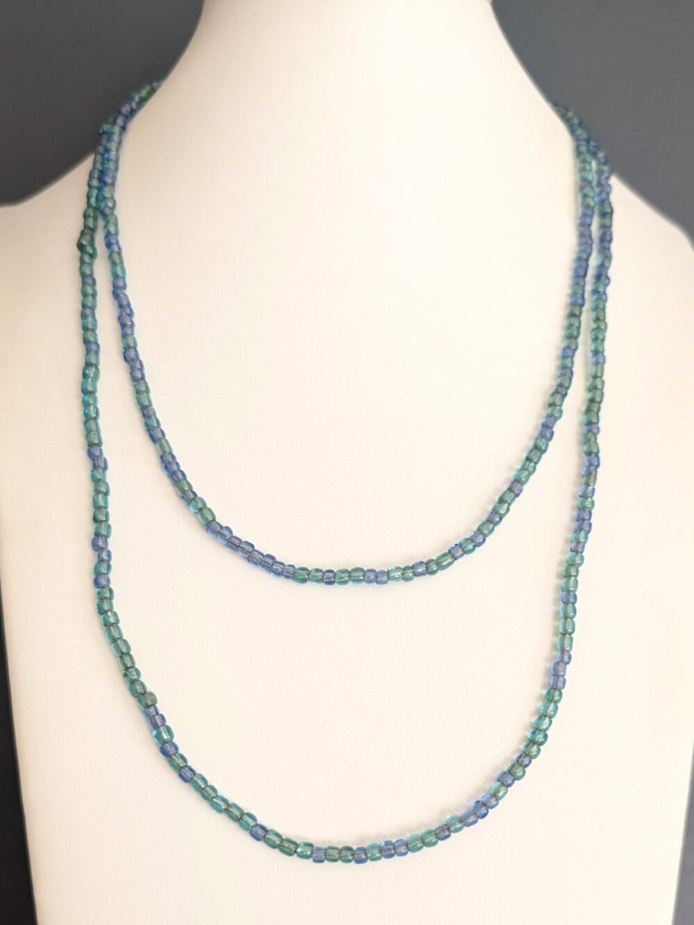 Single strand pale teal and blue/purple tiny glass beaded necklace